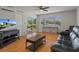 Bright living room boasts wood floors, modern furniture, and access to the outside at 416 73Rd N Ave # 205, St Petersburg, FL 33702
