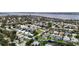 Aerial view showcases this waterfront community's lush landscaping and canal access at 4306 Barracuda Dr, Bradenton, FL 34208