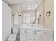 Bathroom features white cabinets, neutral walls and flooring and a framed mirror at 4306 Barracuda Dr, Bradenton, FL 34208