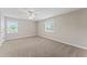 Carpeted bedroom featuring neutral colors, natural light and a ceiling fan at 4306 Barracuda Dr, Bradenton, FL 34208