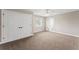 Carpeted bedroom with large closet features ensuite bathroom and natural light at 4306 Barracuda Dr, Bradenton, FL 34208