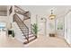 Entryway with staircase showcasing tile floors and natural light at 4306 Barracuda Dr, Bradenton, FL 34208
