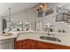 Well-appointed kitchen featuring custom wood cabinets, stainless steel appliances, and open layout to dining at 4306 Barracuda Dr, Bradenton, FL 34208