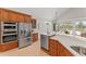 Gourmet kitchen with stainless steel appliances, custom cabinets, and an open layout at 4306 Barracuda Dr, Bradenton, FL 34208
