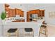 Well-equipped kitchen with quartz countertops, stainless steel appliances, breakfast bar, and wooden cabinets at 4306 Barracuda Dr, Bradenton, FL 34208