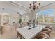 Bright living room featuring large windows, shutter blinds, and stylish furniture arrangement at 4306 Barracuda Dr, Bradenton, FL 34208