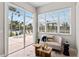 Bright sitting area with outdoor view to pool area and access to outdoor patio at 4306 Barracuda Dr, Bradenton, FL 34208