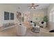 Comfortable living room with a staircase, three seats, and a round table in the center at 4306 Barracuda Dr, Bradenton, FL 34208