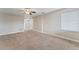 Spacious living area features neutral carpet, paint, and ample natural light at 4306 Barracuda Dr, Bradenton, FL 34208