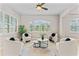 Bright living room featuring large windows, plush seating, and stylish decor at 4306 Barracuda Dr, Bradenton, FL 34208