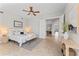 Spacious bedroom suite with sitting area, neutral palette, ceiling fan and ample natural light at 4306 Barracuda Dr, Bradenton, FL 34208