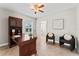 Comfortable office space with a wooden desk, two chairs, and a view to the outside at 4306 Barracuda Dr, Bradenton, FL 34208