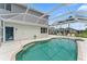 A clear pool is surrounded by a screened enclosure, offering a refreshing escape in a private backyard setting at 4306 Barracuda Dr, Bradenton, FL 34208