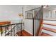 Staircase showcasing wood stairs and decorative iron railing, open floor plan, and high ceilings at 4306 Barracuda Dr, Bradenton, FL 34208