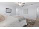 Neutral bedroom featuring a ceiling fan, natural light, and a decorative rug at 4312 E Shadowlawn Ave, Tampa, FL 33610