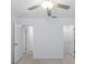This bedroom includes doors, ample wall space and modern ceiling fan at 4312 E Shadowlawn Ave, Tampa, FL 33610