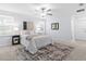 Neutral bedroom featuring a ceiling fan, natural light, and a decorative rug at 4312 E Shadowlawn Ave, Tampa, FL 33610