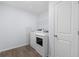 Bright laundry room featuring modern washer and dryer and ample storage at 4312 E Shadowlawn Ave, Tampa, FL 33610