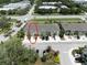 Aerial view of townhomes, highlighting the layout, parking, landscaping, and proximity to nearby streets and amenities at 4504 Silver Lining St, Sarasota, FL 34238