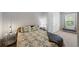 Bright bedroom with natural light featuring a full sized bed and stylish furnishings at 4504 Silver Lining St, Sarasota, FL 34238