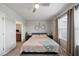 Relaxing bedroom with natural light, neutral colored walls and ensuite bathroom entrance at 4504 Silver Lining St, Sarasota, FL 34238
