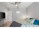 Comfortable bedroom with ceiling fan, soft carpet, and a stylish botanical-patterned duvet at 4504 Silver Lining St, Sarasota, FL 34238