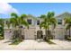 Charming townhome featuring a two-car garage, well-manicured landscaping, and inviting curb appeal at 4504 Silver Lining St, Sarasota, FL 34238