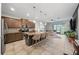 Modern kitchen with stainless steel appliances, granite countertops, and a breakfast bar with seating at 4504 Silver Lining St, Sarasota, FL 34238