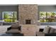Inviting lounge area showcasing a stone fireplace and comfortable seating, perfect for relaxation and socializing at 4504 Silver Lining St, Sarasota, FL 34238