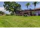 Lush backyard with screened in patio and palm trees at 50 Ingrid Pl # 50, Oldsmar, FL 34677