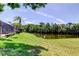 Backyard area with pond and view of screened in patio at 50 Ingrid Pl # 50, Oldsmar, FL 34677