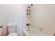 Clean bathroom featuring a bathtub with shower and toilet with white tile walls at 50 Ingrid Pl # 50, Oldsmar, FL 34677