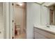 Well-lit bathroom featuring a toilet, vanity with sink and a shower with tub at 50 Ingrid Pl # 50, Oldsmar, FL 34677