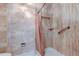 The shower in this bathroom features grab bars, a shower curtain, and a small shelf at 50 Ingrid Pl # 50, Oldsmar, FL 34677