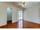 A bright hardwood bedroom with sliding door access to an outdoor patio at 50 Ingrid Pl # 50, Oldsmar, FL 34677
