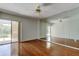Bright bedroom with hardwood floors, sliding glass doors and large mirrored wall at 50 Ingrid Pl # 50, Oldsmar, FL 34677