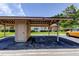 Carport and storage shed offering covered parking and storage with view of home at 50 Ingrid Pl # 50, Oldsmar, FL 34677