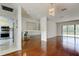 Bright dining area with hardwood floors and sliding glass doors connecting to the eat-in kitchen area at 50 Ingrid Pl # 50, Oldsmar, FL 34677