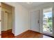 Foyer featuring hardwood floors, bright natural light and access to the entry closet at 50 Ingrid Pl # 50, Oldsmar, FL 34677