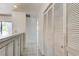 Hallway with white cabinets, storage, and doors to the kitchen and dining room at 50 Ingrid Pl # 50, Oldsmar, FL 34677