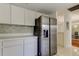 Bright kitchen with modern stainless steel refrigerator and a stylish backsplash at 50 Ingrid Pl # 50, Oldsmar, FL 34677