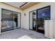 Spacious private patio area with dual sliding glass door access to the home's interior at 50 Ingrid Pl # 50, Oldsmar, FL 34677