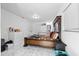 Bedroom with a large bed, crib, dresser, and white-tiled floors at 5109 N 30Th St, Tampa, FL 33610
