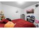 Bedroom with window, and a TV on the wall, dresser and disorganized decor at 5109 N 30Th St, Tampa, FL 33610