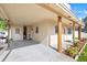 Covered porch featuring painted support beams, neutral siding, and a welcoming entrance at 5109 N 30Th St, Tampa, FL 33610