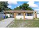 Charming single-story home with a covered front porch and well-maintained lawn at 5109 N 30Th St, Tampa, FL 33610