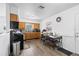 Eat-in kitchen with light oak cabinets, wood-look floors, and natural light at 5109 N 30Th St, Tampa, FL 33610