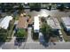 Aerial view of home with a well-maintained yard and canal access at 5824 Coventry Dr, Tampa, FL 33615