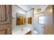 Well-lit bathroom with vanity, sink, mirror, and built-in cabinet at 5824 Coventry Dr, Tampa, FL 33615