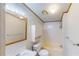 Bright bathroom featuring a vanity, sink, mirror, toilet and shower/tub combination at 5824 Coventry Dr, Tampa, FL 33615